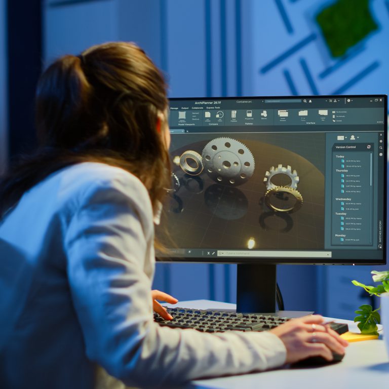 Woman architect working in modern cad program overtime sitting at desk in start-up business office. Industrial employee studying prototype idea on computer showing cad software on device display