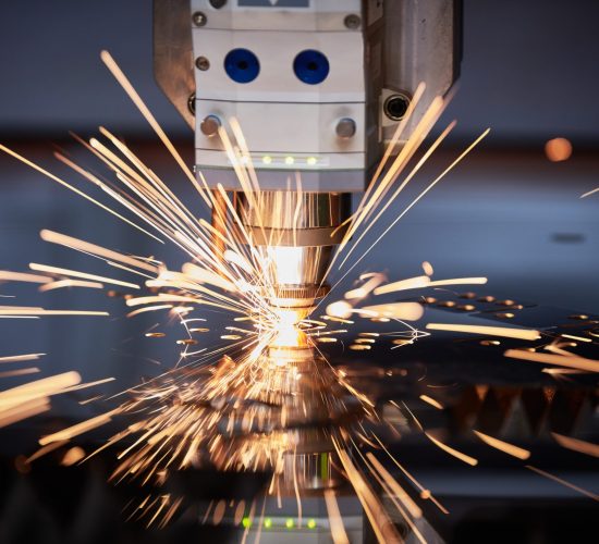 laser cutting. Metal processing on cnc laser machine with sparks